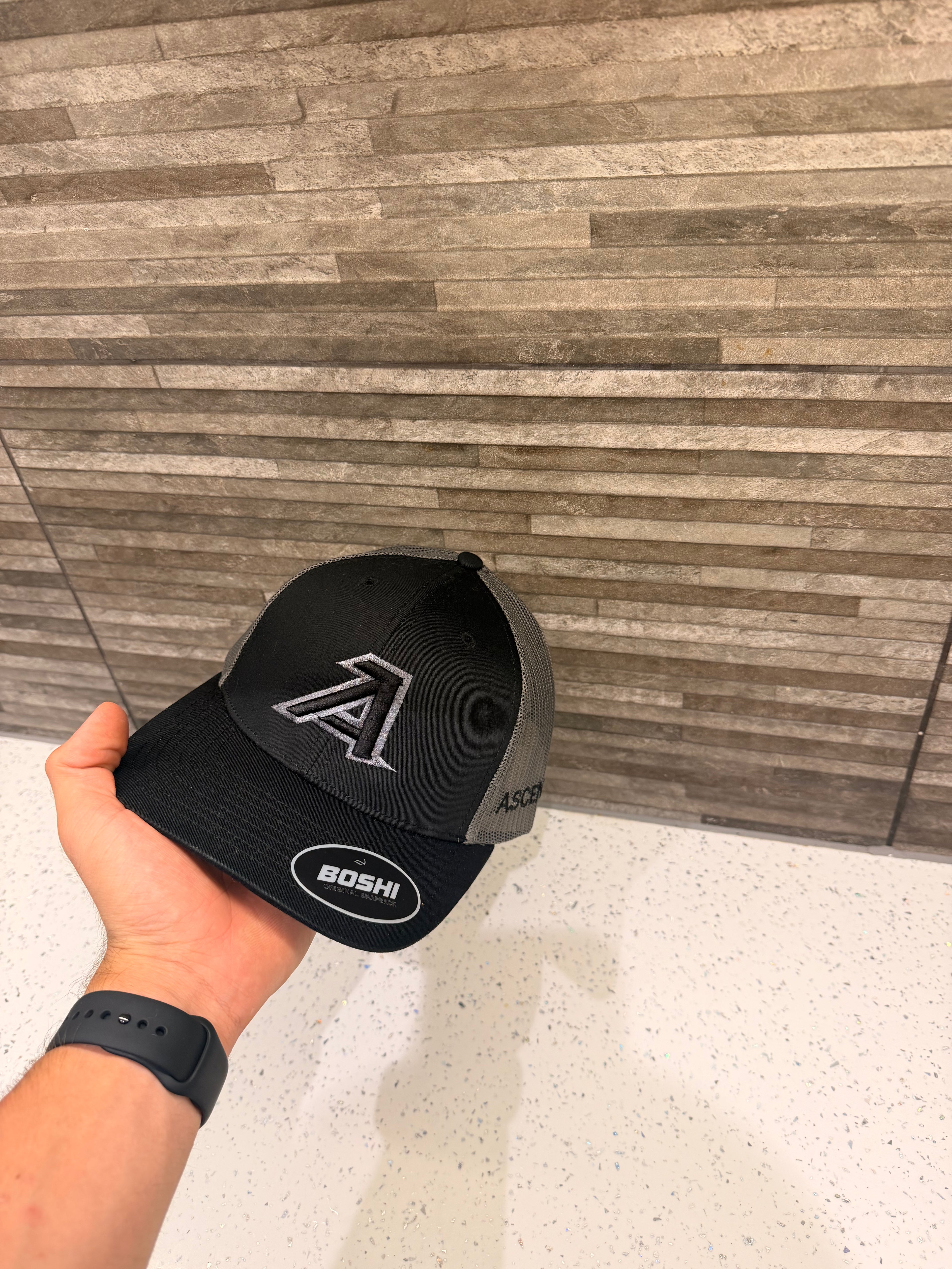 Black and gray ascend caps
